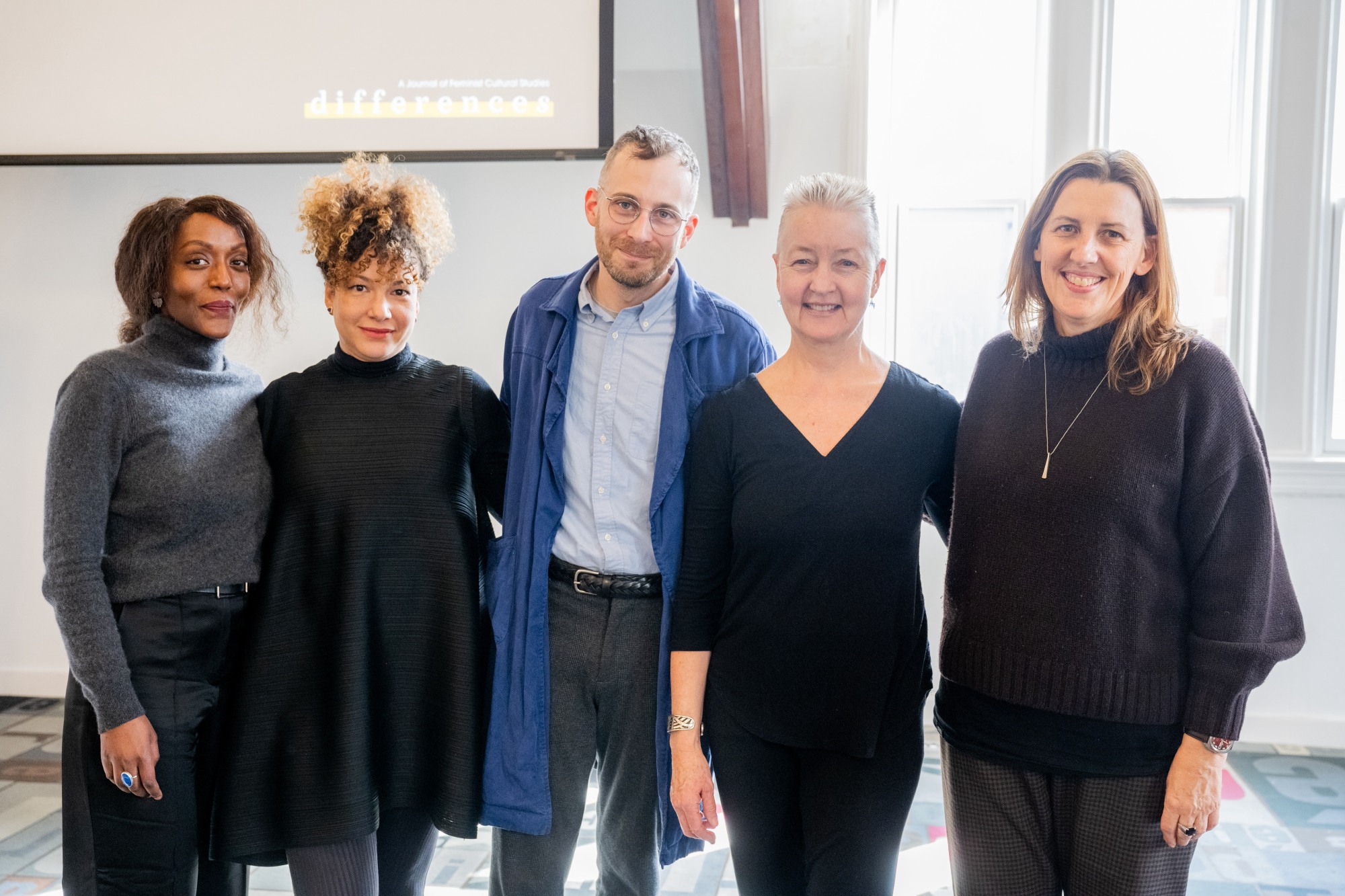 The five colloquium speakers standing next to each other.
