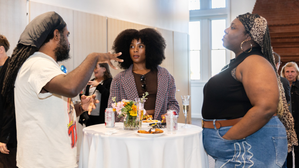 People socializing at the celebration.