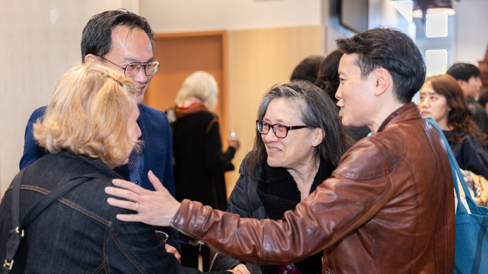 People socializing at the celebration.