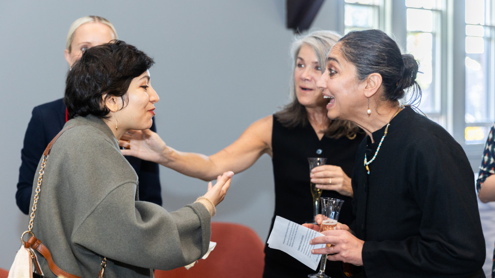 People socializing at the celebration.