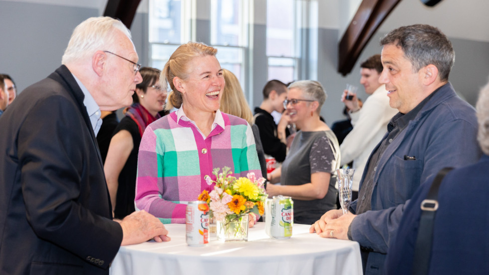 People socializing at the celebration.