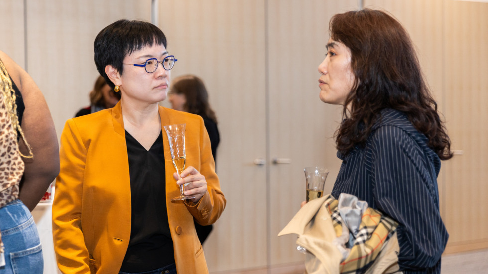 People socializing at the celebration.