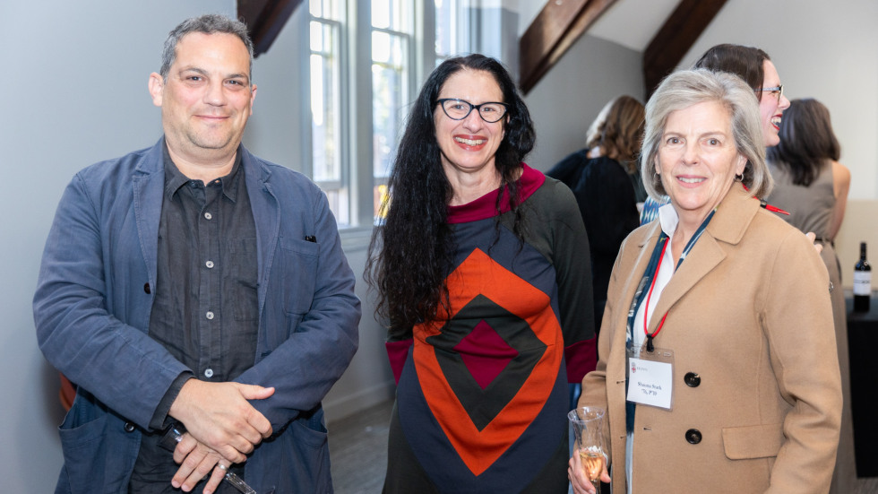 People socializing at the celebration.