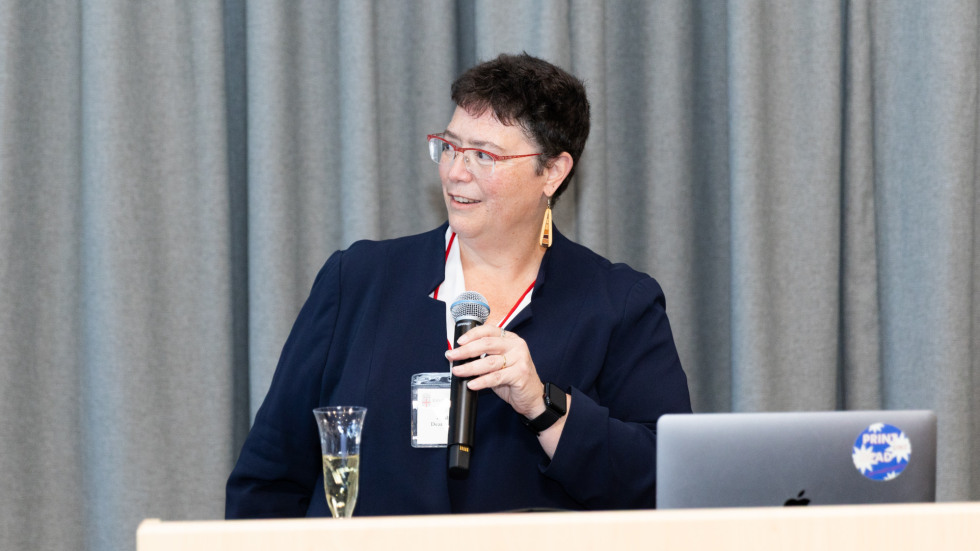 Leah VanWey speaks into a microphone.