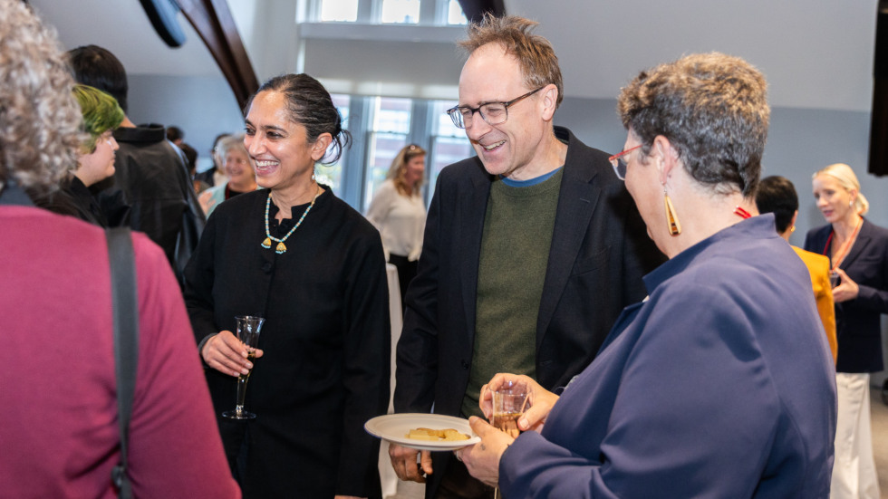 People socializing at the celebration.