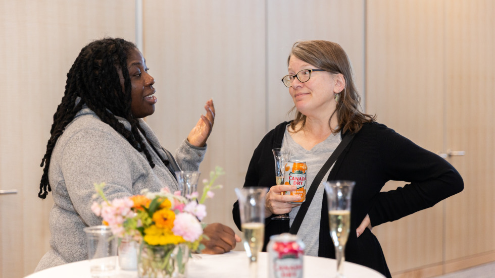 People socializing at the celebration.