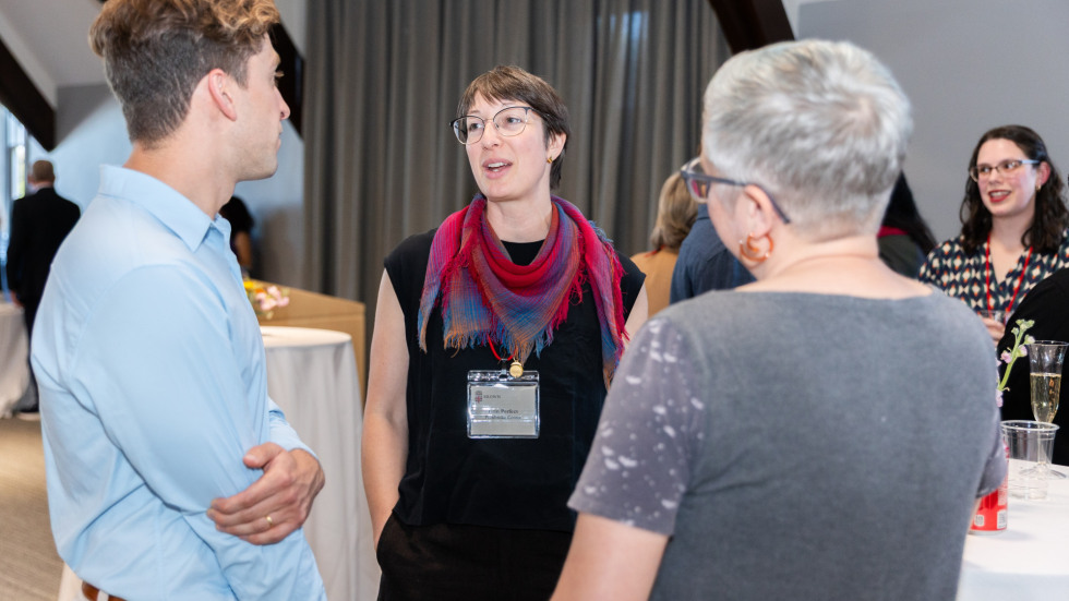 People socializing at the celebration.