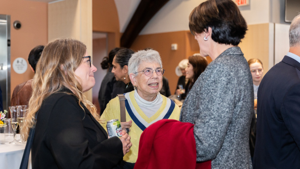 People socializing at the celebration.