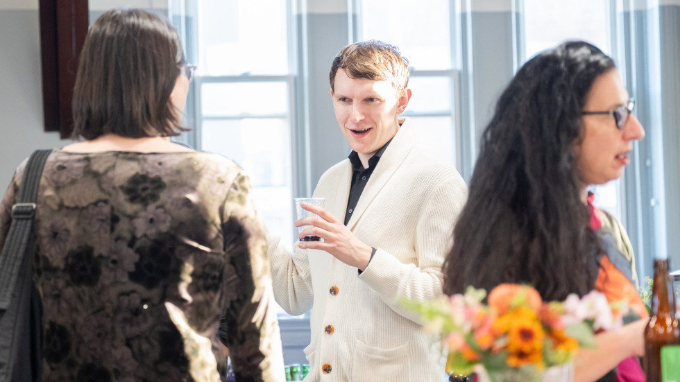 People socializing at the celebration.
