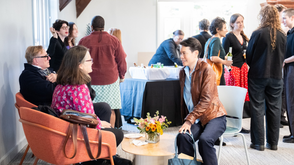 People socializing at the celebration.