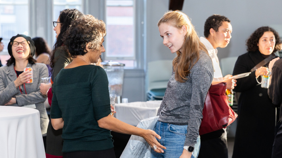 People socializing at the celebration.