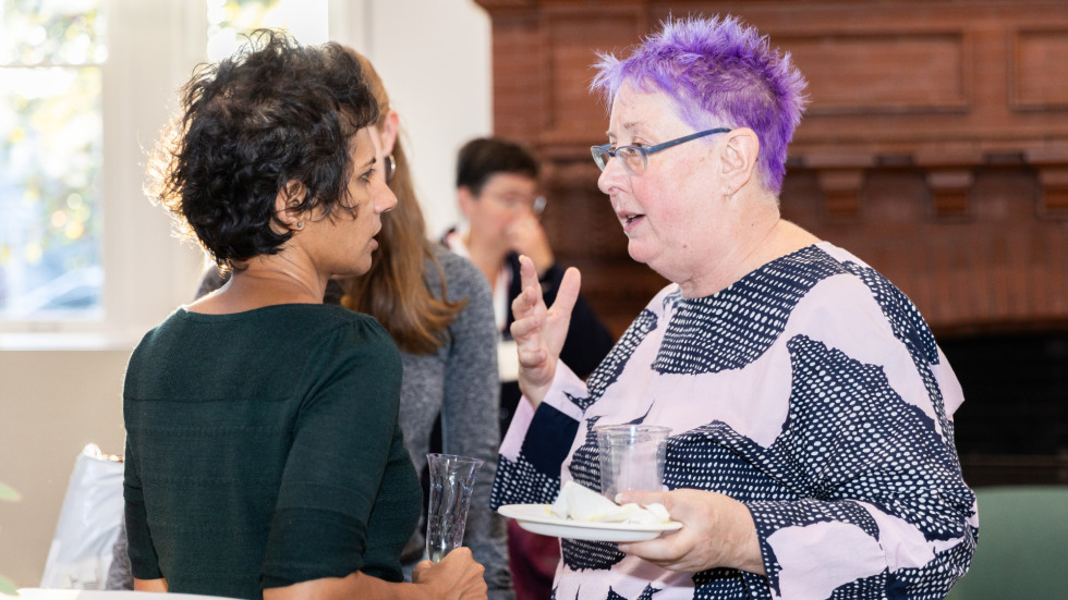People socializing at the celebration.