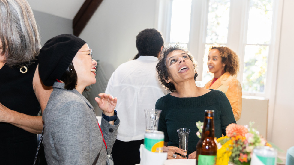 People socializing at the celebration.