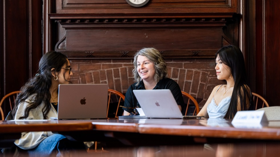 Visiting Assistant Professor of the Practice Sarah Gamble with two of her students